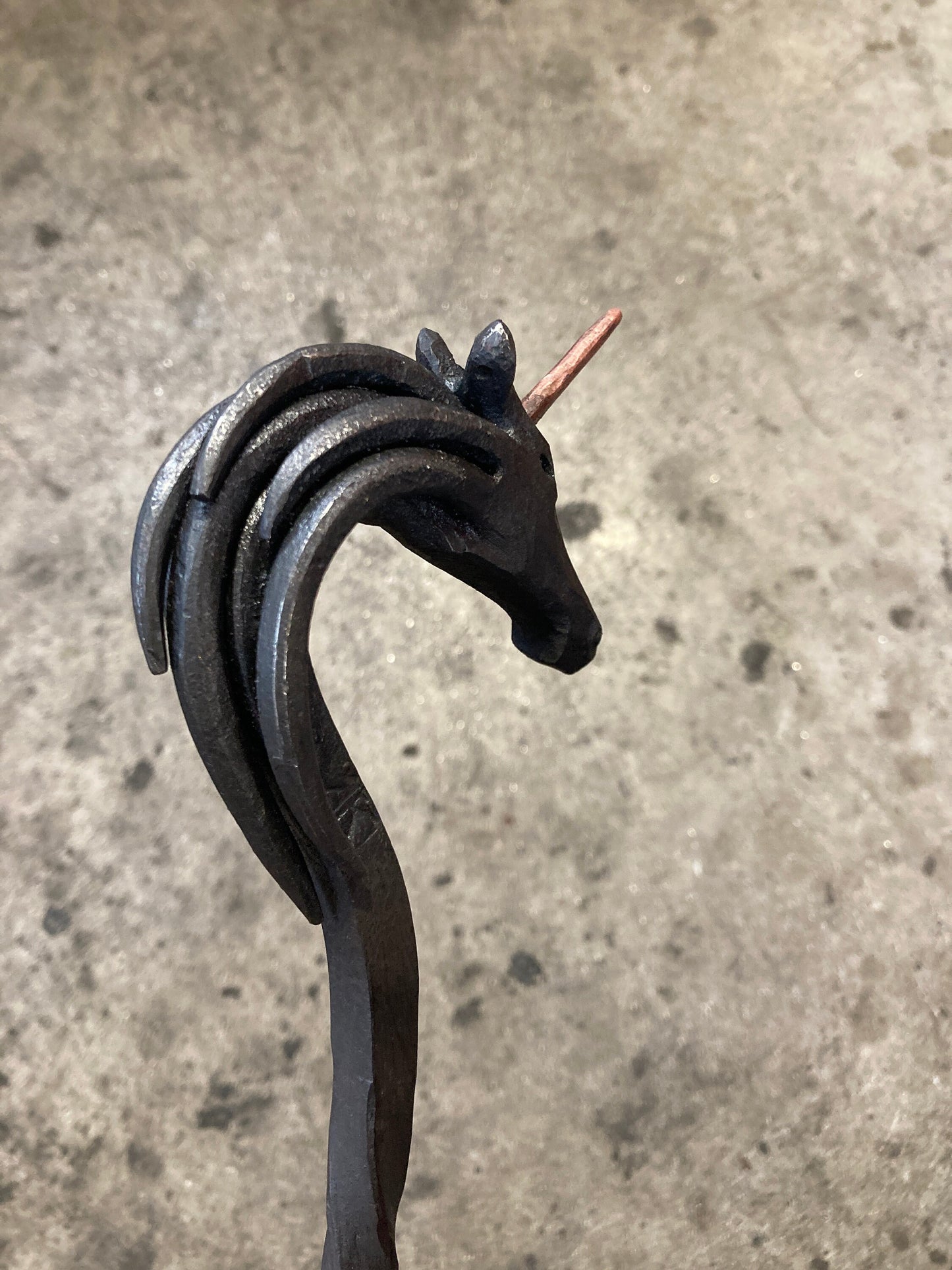 Hand forged unicorn fire poker