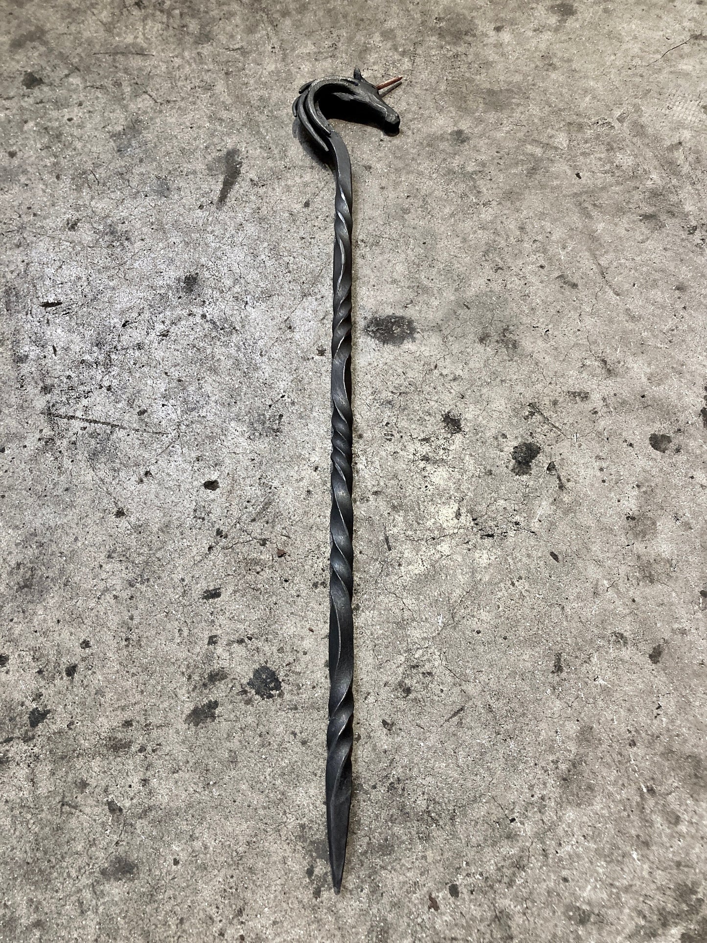 Hand forged unicorn fire poker