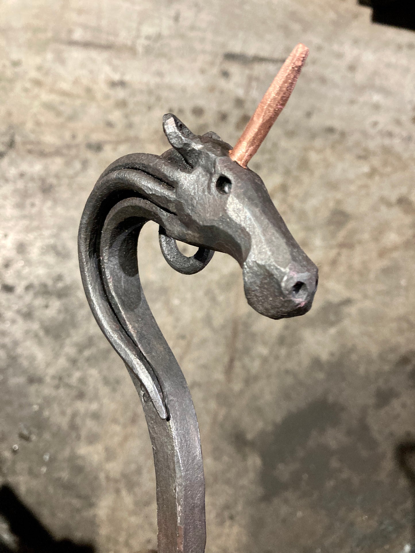 Hand forged unicorn fire poker