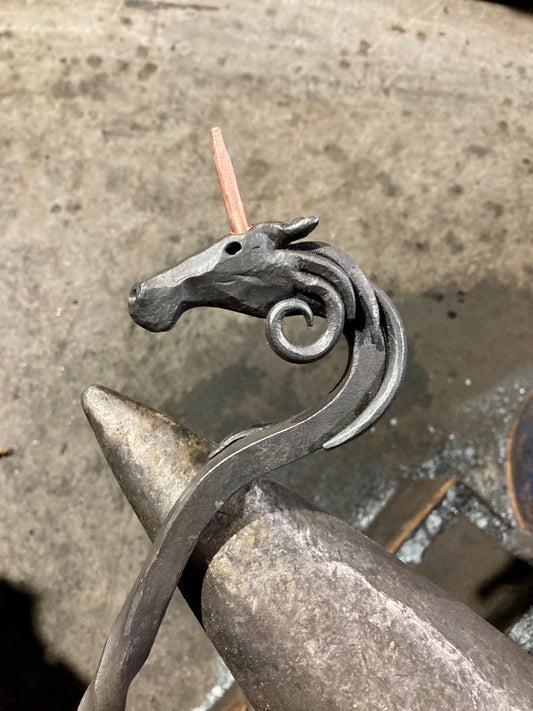 Hand forged unicorn fire poker